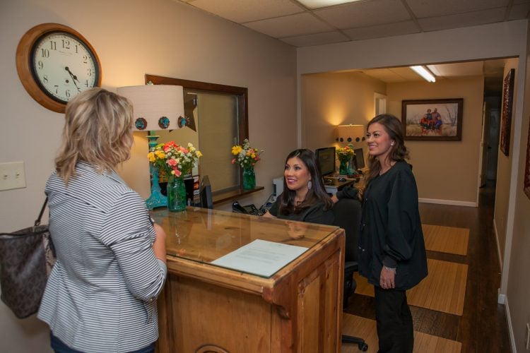 Smart Family Dentistry staff member registering a patient