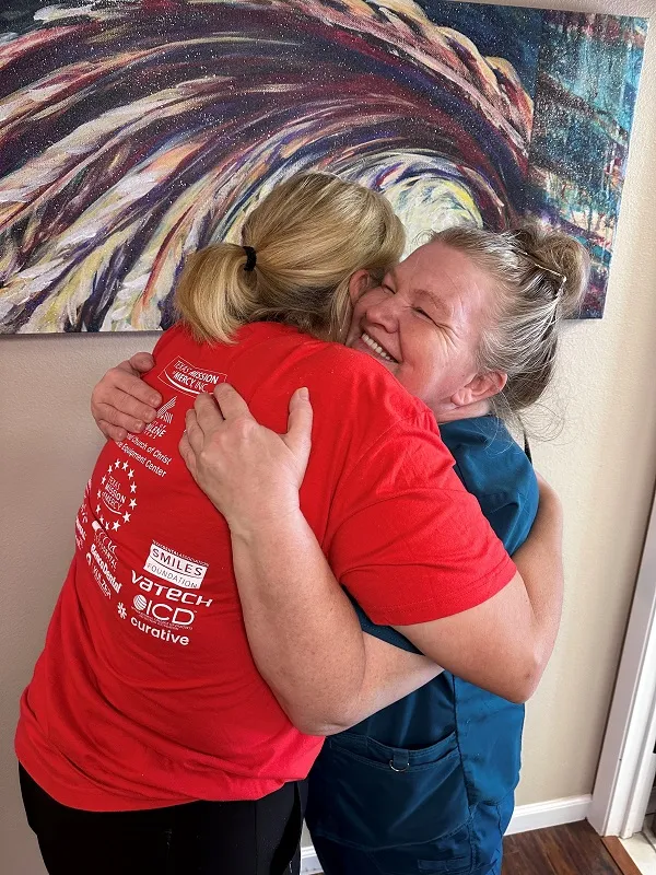 Dr. Lyndi Smart hugging patient