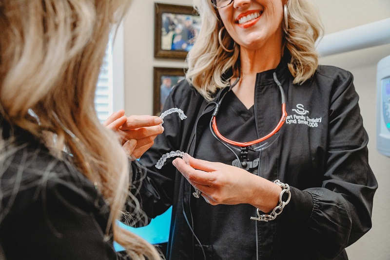 Doctor showing Invisalign aligner