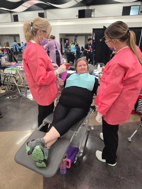 Prepping patient for procedure at event